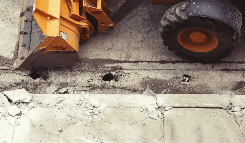 Heavy machine on a broken concrete slab